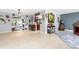 Open floor plan showcases the living room with tile flooring and stylish decor throughout at 158 Morgan Se Ln, Port Charlotte, FL 33952
