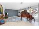 Open living room showcasing a baby grand piano, tile floors, and bright natural light at 158 Morgan Se Ln, Port Charlotte, FL 33952