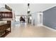 Open living room features tile flooring and seamless transitions to the kitchen and entryway at 158 Morgan Se Ln, Port Charlotte, FL 33952