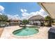 Beautiful backyard oasis with pool, tiki hut, and waterfront views, perfect for outdoor entertaining at 158 Morgan Se Ln, Port Charlotte, FL 33952