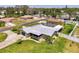 Aerial view of single Gathering house with well-manicured lawn at 1585 Poinciana Rd, Venice, FL 34293