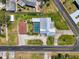 Aerial view of a home with a pool and screened-in lanai at 1585 Poinciana Rd, Venice, FL 34293