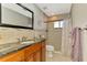 Elegant bathroom featuring a granite countertop and tiled shower with modern fixtures at 1585 Poinciana Rd, Venice, FL 34293