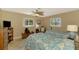 Bright bedroom with two twin beds, a teddy bear, and hardwood furniture at 1585 Poinciana Rd, Venice, FL 34293