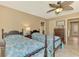 Bedroom with two twin beds features tiled floors and ceiling fan at 1585 Poinciana Rd, Venice, FL 34293
