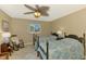 Bedroom featuring two beds, neutral walls, and ceiling fan at 1585 Poinciana Rd, Venice, FL 34293