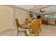 Charming dining area with decorative chairs, adjacent to the living room and kitchen at 1585 Poinciana Rd, Venice, FL 34293