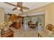 View of the kitchen and dining area, leading to the inviting outdoor pool space at 1585 Poinciana Rd, Venice, FL 34293