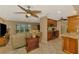 Open-concept living room with a view into the kitchen and breakfast nook at 1585 Poinciana Rd, Venice, FL 34293