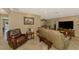 The living room features cozy furniture, neutral walls and lots of natural light at 1585 Poinciana Rd, Venice, FL 34293