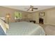 Comfortable main bedroom with a sitting area, soft lighting and neutral decor at 1585 Poinciana Rd, Venice, FL 34293