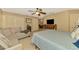 Inviting main bedroom featuring a sitting area, ample closet space, and soft color palette at 1585 Poinciana Rd, Venice, FL 34293