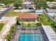 Aerial view of the pool area surrounded by a screened enclosure and an additional structure at 1585 Poinciana Rd, Venice, FL 34293