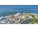 Aerial view of waterfront community with canal and dock access to the ocean at 17 Southwind Dr, Englewood, FL 34223