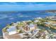 Stunning aerial view of waterfront homes, showcasing coastal living with serene water and picturesque landscaping at 17 Southwind Dr, Englewood, FL 34223