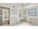 Spacious bedroom offers customization with unfinished drywall, concrete floors, and ample natural light from a window at 17 Southwind Dr, Englewood, FL 34223