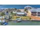 Waterfront home with mature palms, dock, and screened porch at 17 Southwind Dr, Englewood, FL 34223