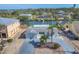 Charming waterfront home featuring a well-maintained lawn, mature palms and a private drive at 17 Southwind Dr, Englewood, FL 34223