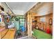 Garage featuring wood walls with tools and accessories at 17 Southwind Dr, Englewood, FL 34223