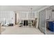 Living room showcasing tile flooring, partially renovated walls, and furniture at 17 Southwind Dr, Englewood, FL 34223