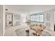 Partially renovated living room with tile flooring and a large window with backyard views at 17 Southwind Dr, Englewood, FL 34223