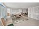 Spacious living room showcasing tile flooring and partially renovated walls and trim at 17 Southwind Dr, Englewood, FL 34223