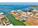 Impressive aerial view of waterfront homes with private docks and canals, surrounded by lush landscaping at 1915 Illinois Ave, Englewood, FL 34224