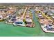 Gorgeous aerial shot of luxury waterfront homes along canals, surrounded by lush greenery and ocean views at 1915 Illinois Ave, Englewood, FL 34224