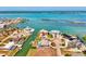 Stunning aerial view of waterfront homes along a canal, boasting private docks and easy ocean access at 1915 Illinois Ave, Englewood, FL 34224