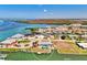 Waterfront property featuring a private dock and a pool, surrounded by stunning blue waters at 1915 Illinois Ave, Englewood, FL 34224