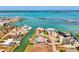 Picturesque aerial view of a waterfront home with a private pool and dock, nestled in a scenic coastal community at 1915 Illinois Ave, Englewood, FL 34224