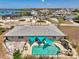 Aerial view of a home with a pool and dock on a waterfront property showcasing the beautiful coastal landscape at 1915 Illinois Ave, Englewood, FL 34224