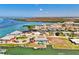 Scenic aerial showcasing waterfront homes along canals, with lush landscaping and stunning water views at 1915 Illinois Ave, Englewood, FL 34224