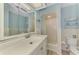Cozy bathroom with large mirror and vanity offering plenty of storage space at 1915 Illinois Ave, Englewood, FL 34224