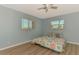 Sunny bedroom with views of the neighborhood and comfortable queen size bed at 1915 Illinois Ave, Englewood, FL 34224