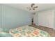Relaxing bedroom with plenty of closet space, access to adjoining room and ceiling fan at 1915 Illinois Ave, Englewood, FL 34224