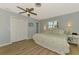 Bedroom with light blue walls and flooring at 1915 Illinois Ave, Englewood, FL 34224
