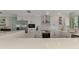 Spacious kitchen with an island, stainless appliances and modern finishes at 1915 Illinois Ave, Englewood, FL 34224