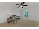 Relaxing room with wicker furniture and access to an additional room at 1915 Illinois Ave, Englewood, FL 34224