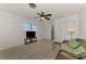 Relaxing living room with television, love seat and direct access to an adjoining bathroom at 1915 Illinois Ave, Englewood, FL 34224