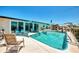 Backyard pool area perfect for relaxing, with an outdoor kitchen at 1915 Illinois Ave, Englewood, FL 34224