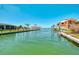 Scenic waterfront view featuring canal access and beautiful homes on a clear day at 1915 Illinois Ave, Englewood, FL 34224