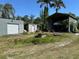 Exterior view of the outbuildings and workshop shed on the property at 1916 Myrtle Ave, Punta Gorda, FL 33950