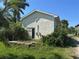 Exterior side view of property and landscaping around the home at 1916 Myrtle Ave, Punta Gorda, FL 33950