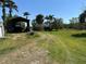 Large property with outbuildings and a long driveway at 1916 Myrtle Ave, Punta Gorda, FL 33950