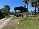 Exterior shed with room to store machinery and landscaping equipment at 1916 Myrtle Ave, Punta Gorda, FL 33950