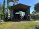 Exterior shed with room to store machinery and landscaping equipment at 1916 Myrtle Ave, Punta Gorda, FL 33950