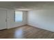 A bright and airy living room featuring wood floors, neutral walls, and a window for natural light at 194 Garden Nw Ave, Port Charlotte, FL 33952