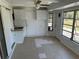 Enclosed porch area with tiled floors, offering extra space for relaxation and storage at 194 Garden Nw Ave, Port Charlotte, FL 33952