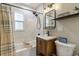 Bathroom with tub, vanity, and shelf at 21070 Gertrude Ave, Port Charlotte, FL 33952